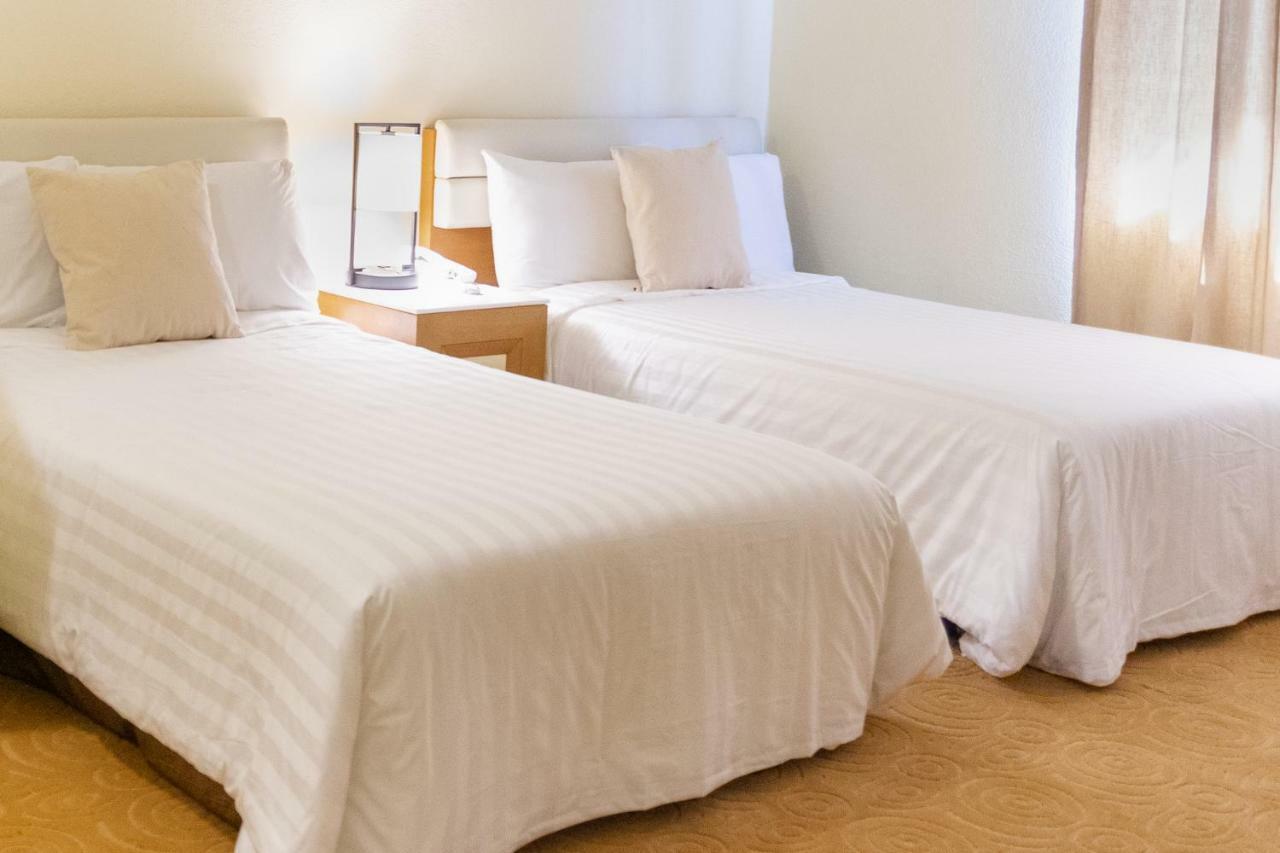 One Pacific Hotel Тамунинг Экстерьер фото